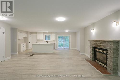 24 Parkside Avenue, South Bruce Peninsula, ON - Indoor Photo Showing Living Room With Fireplace