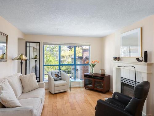 306-1063 Southgate St, Victoria, BC - Indoor Photo Showing Living Room With Fireplace