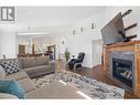 374 Trumpeter Court, Kelowna, BC  - Indoor Photo Showing Living Room With Fireplace 