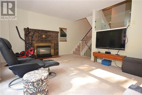 27 Reaney Court, Ottawa, ON - Indoor Photo Showing Living Room With Fireplace