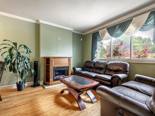 Living room - 109 Evergreen Drive, Beaconsfield, QC - Indoor Photo Showing Living Room With Fireplace