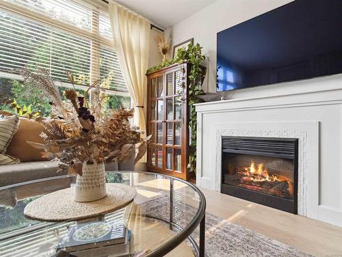 208-1035 Sutlej St, Victoria, BC - Indoor Photo Showing Living Room With Fireplace