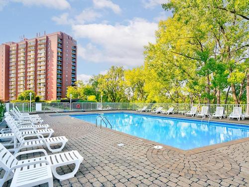 Piscine - 203-520 Place Juge-Desnoyers, Laval (Pont-Viau), QC - Outdoor With In Ground Pool