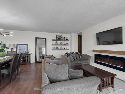 1908-25 Kensington Rd, Brampton, ON - Indoor Photo Showing Living Room With Fireplace