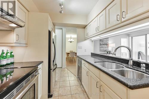 418 - 20 Southport Street, Toronto (High Park-Swansea), ON - Indoor Photo Showing Kitchen With Double Sink