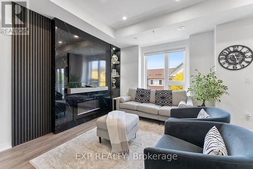 1207 - 2635 William Jackson Drive, Pickering, ON - Indoor Photo Showing Living Room With Fireplace