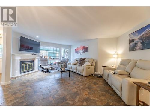 805 Comox Street Unit# 143, Penticton, BC - Indoor Photo Showing Living Room With Fireplace