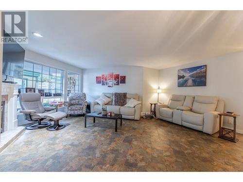 805 Comox Street Unit# 143, Penticton, BC - Indoor Photo Showing Living Room With Fireplace