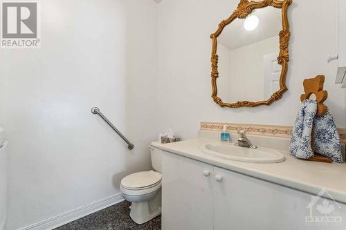 main floor powder room with washer and dryer - 1075 Normandy Crescent, Ottawa, ON - Indoor Photo Showing Bathroom