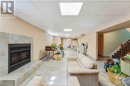 basement - 1075 Normandy Crescent, Ottawa, ON - Indoor Photo Showing Living Room With Fireplace