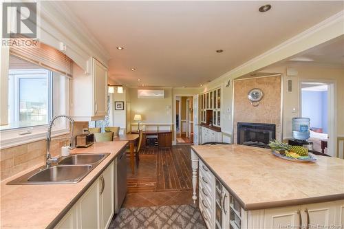 703 Acadie Street, Grande-Anse, NB - Indoor Photo Showing Kitchen With Fireplace With Double Sink