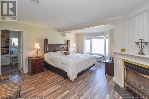 703 Acadie Street, Grande-Anse, NB - Indoor Photo Showing Bedroom With Fireplace