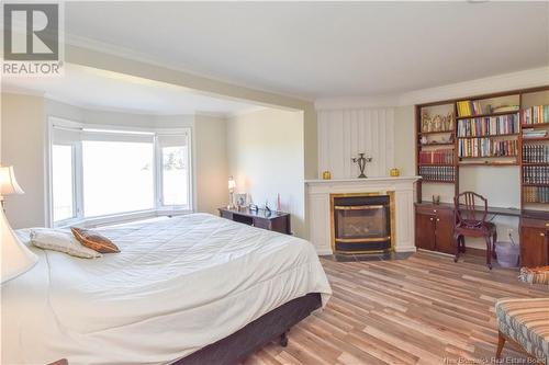 703 Acadie Street, Grande-Anse, NB - Indoor Photo Showing Bedroom With Fireplace