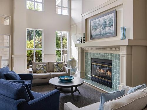 203-5685 Edgewater Lane, Nanaimo, BC - Indoor Photo Showing Living Room With Fireplace