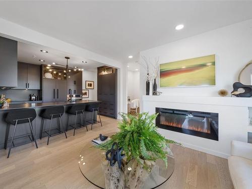 305-1033 Cook St, Victoria, BC - Indoor Photo Showing Living Room With Fireplace