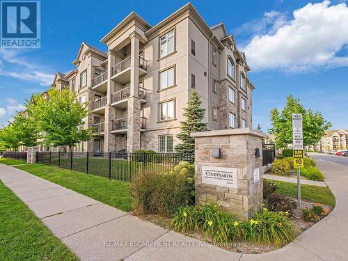 414 - 1440 Main Street E, Milton (Dempsey), ON - Outdoor With Balcony With Facade