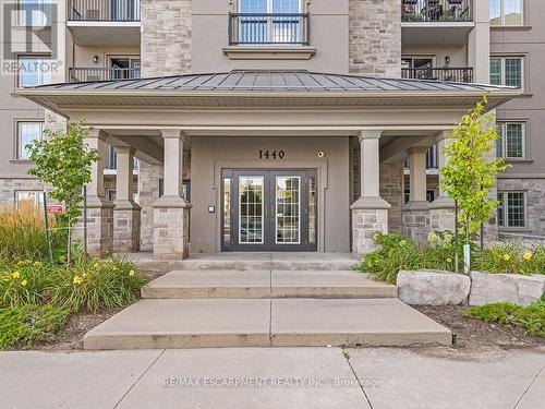 414 - 1440 Main Street E, Milton (Dempsey), ON - Outdoor With Balcony With Facade