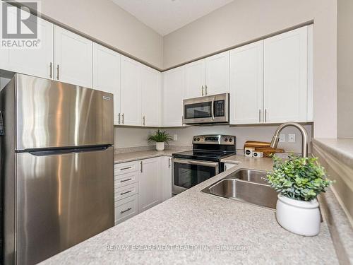 414 - 1440 Main Street E, Milton (Dempsey), ON - Indoor Photo Showing Kitchen With Stainless Steel Kitchen With Double Sink With Upgraded Kitchen