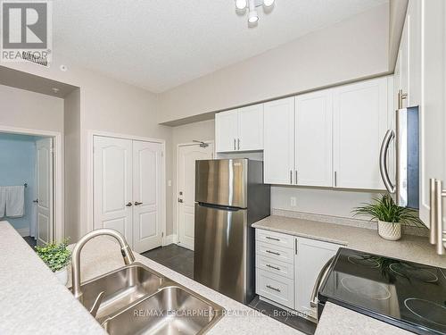 414 - 1440 Main Street E, Milton (Dempsey), ON - Indoor Photo Showing Kitchen With Stainless Steel Kitchen With Double Sink