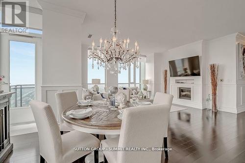 Ph02 - 4070 Confederation Parkway, Mississauga, ON - Indoor Photo Showing Dining Room With Fireplace