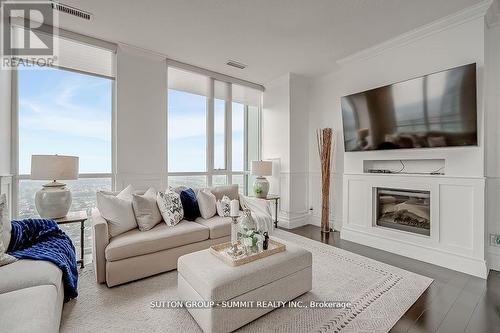 Ph02 - 4070 Confederation Parkway, Mississauga (City Centre), ON - Indoor Photo Showing Living Room With Fireplace