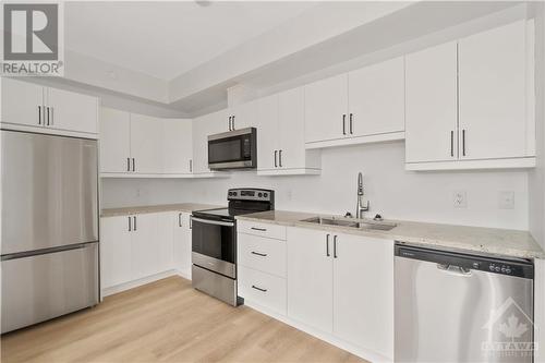 7 Maple Avenue Unit#202, Smiths Falls, ON - Indoor Photo Showing Kitchen With Stainless Steel Kitchen With Double Sink