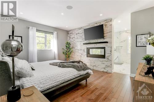 652B Tweedsmuir Avenue, Ottawa, ON - Indoor Photo Showing Bedroom With Fireplace