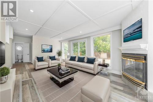 Virtually Staged - 6986 Marco Street, Ottawa, ON - Indoor Photo Showing Living Room With Fireplace