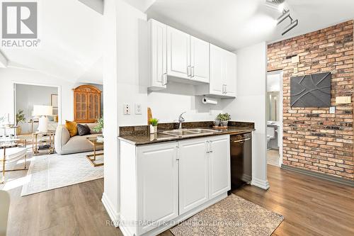 118 - 119 Merton Street, Toronto (Mount Pleasant West), ON - Indoor Photo Showing Kitchen With Fireplace With Double Sink