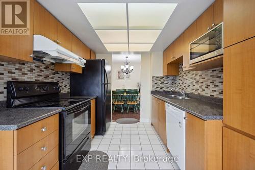 401 - 330 Alton Towers Circle, Toronto (Milliken), ON - Indoor Photo Showing Kitchen With Double Sink