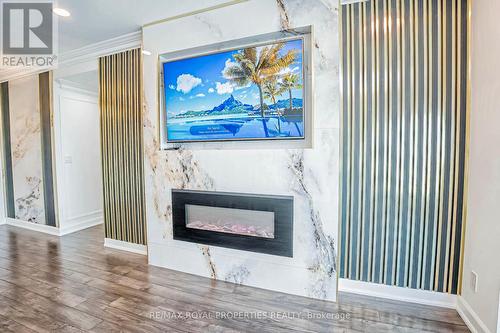 Ph208 - 8 Lee Centre Drive, Toronto (Woburn), ON - Indoor Photo Showing Living Room With Fireplace