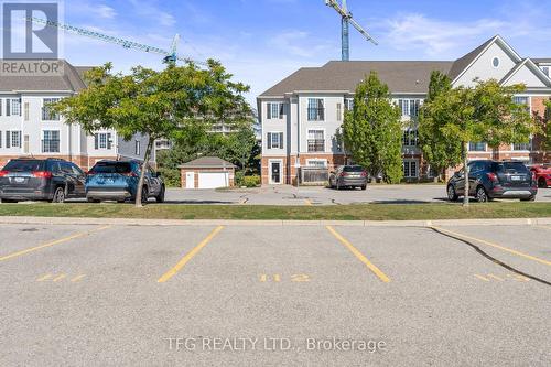 101 - 98 Aspen Springs Drive, Clarington (Bowmanville), ON - Outdoor With Facade