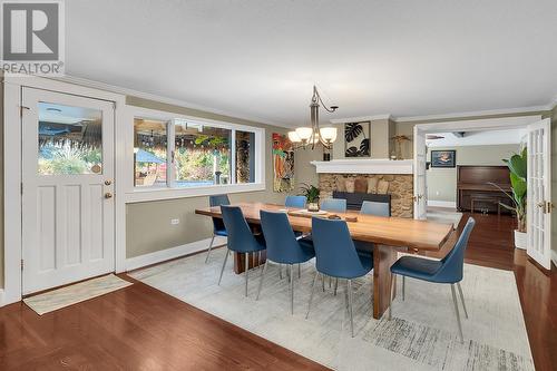 863 Coronado Crescent, Kelowna, BC - Indoor Photo Showing Dining Room With Fireplace