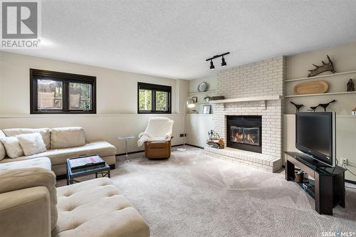 242 Wickenden Crescent, Saskatoon, SK - Indoor Photo Showing Living Room With Fireplace