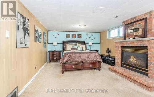 22 Argyle Crescent, Brampton, ON - Indoor Photo Showing Bedroom With Fireplace