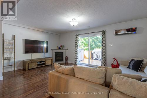 8 - 2062 Lakeshore Road W, Oakville, ON - Indoor Photo Showing Living Room With Fireplace