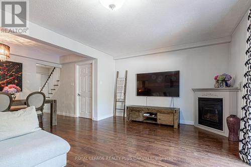 8 - 2062 Lakeshore Road W, Oakville, ON - Indoor Photo Showing Living Room With Fireplace