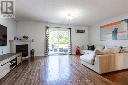 8 - 2062 Lakeshore Road W, Oakville (Bronte West), ON - Indoor Photo Showing Living Room With Fireplace