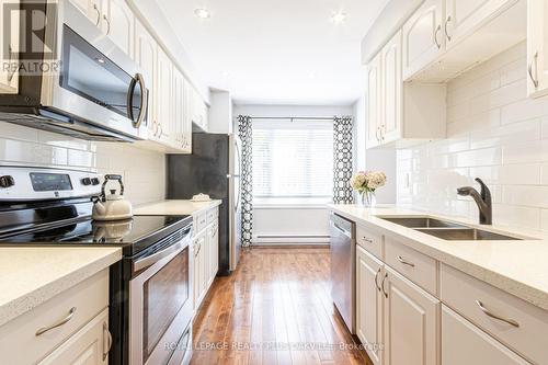 8 - 2062 Lakeshore Road W, Oakville, ON - Indoor Photo Showing Kitchen With Stainless Steel Kitchen With Double Sink With Upgraded Kitchen