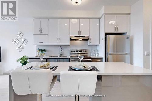 407 - 1105 Leger Way, Milton, ON - Indoor Photo Showing Kitchen With Stainless Steel Kitchen