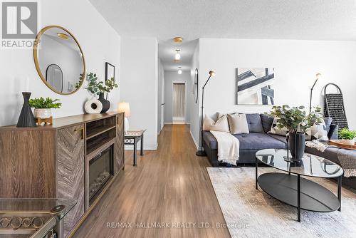 306 - 5 Parkway Forest Drive, Toronto (Henry Farm), ON - Indoor Photo Showing Living Room With Fireplace