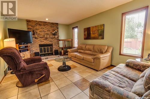 6238 Wellband Drive, Regina, SK - Indoor Photo Showing Living Room With Fireplace