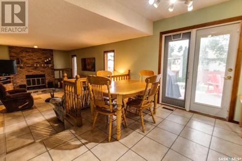 6238 Wellband Drive, Regina, SK - Indoor Photo Showing Dining Room With Fireplace