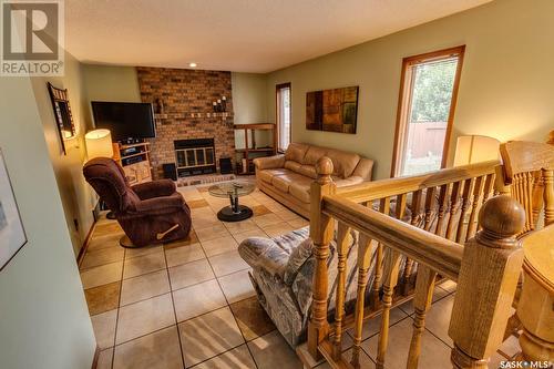 6238 Wellband Drive, Regina, SK - Indoor Photo Showing Living Room With Fireplace