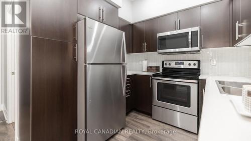 308 - 55 Speers Road, Oakville (Old Oakville), ON - Indoor Photo Showing Kitchen With Stainless Steel Kitchen With Double Sink With Upgraded Kitchen