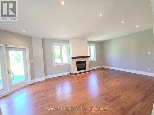 53 Bellehumeur Road, Tiny, ON - Indoor Photo Showing Living Room With Fireplace