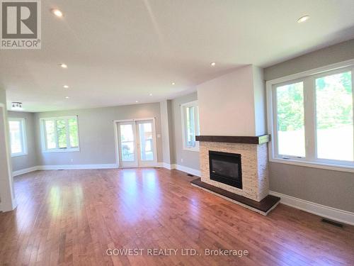 53 Bellehumeur Road, Tiny, ON - Indoor Photo Showing Living Room With Fireplace