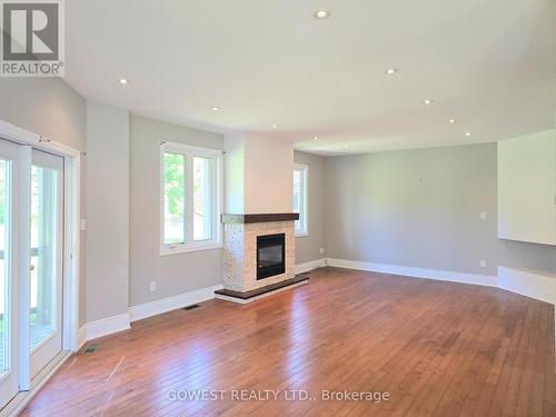 53 Bellehumeur Road, Tiny, ON - Indoor Photo Showing Living Room With Fireplace