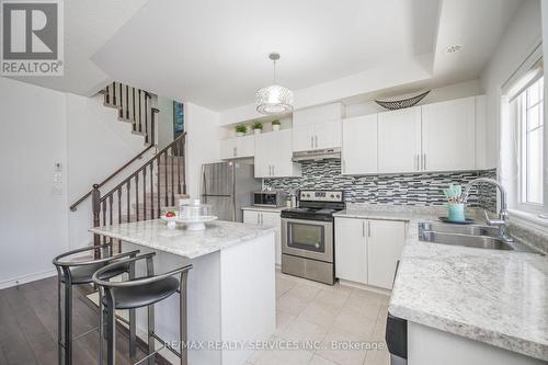 4303 - 2420 Baronwood Drive, Oakville (West Oak Trails), ON - Indoor Photo Showing Kitchen With Stainless Steel Kitchen With Double Sink With Upgraded Kitchen