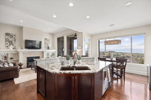 2384 Bellagio Lane, Kelowna, BC - Indoor Photo Showing Kitchen With Fireplace